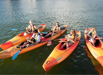 Group eating lunch on the lake in kayaks